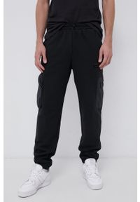 adidas Originals Spodnie męskie kolor czarny gładkie. Kolor: czarny. Wzór: gładki