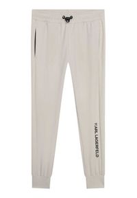 Karl Lagerfeld Kids Spodnie dresowe Z24155 S Beżowy Regular Fit. Kolor: beżowy. Materiał: syntetyk