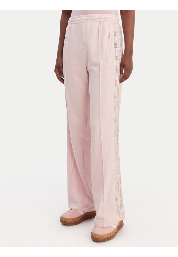 Adidas - adidas Spodnie dresowe Firebird Lace KC6444 Różowy Loose Fit. Kolor: różowy. Materiał: bawełna
