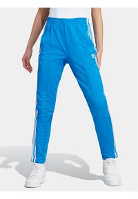 Adidas - adidas Spodnie dresowe adicolor SST IL8817 Niebieski Slim Fit. Kolor: niebieski. Materiał: bawełna