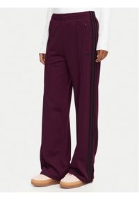 Adidas - adidas Spodnie dresowe Firebird Loose Tracksuit KS4669 Bordowy Loose Fit. Kolor: czerwony. Materiał: syntetyk #1
