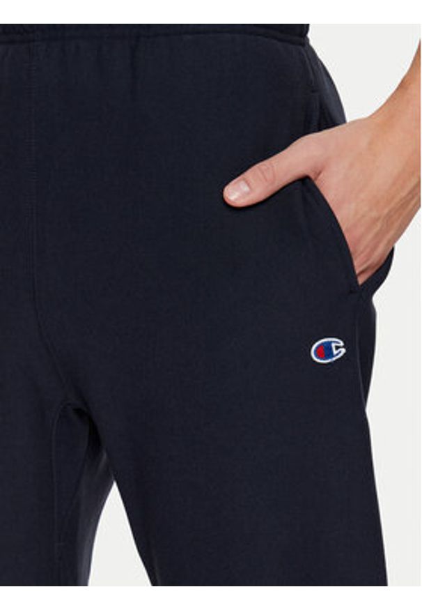 Champion Spodnie dresowe 220709 Granatowy Relaxed Fit. Kolor: niebieski. Materiał: bawełna