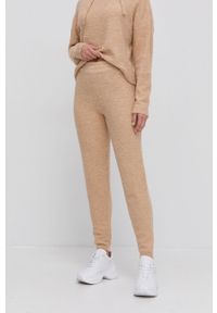 Guess Spodnie z domieszką wełny damskie kolor beżowy. Stan: podwyższony. Kolor: beżowy. Materiał: wełna