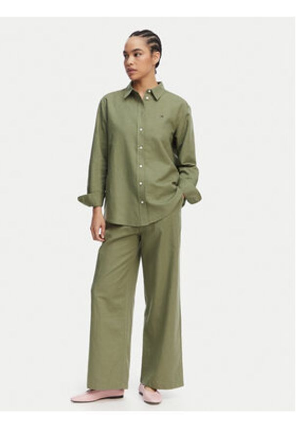 Tommy Jeans Koszula DW0DW22209 Zielony Relaxed Fit. Kolor: zielony. Materiał: len