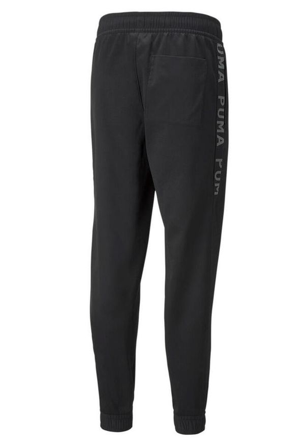 Spodnie męskie Puma TRAIN FIT PWRFLEECE. Kolor: czarny. Materiał: dresówka. Sport: piłka nożna