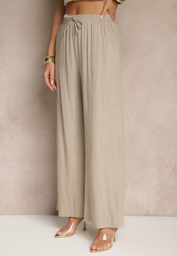 Renee - Beżowe Spodnie z Lnem o Szerokim Kroju z Gumką w Talii Filarive. Okazja: na co dzień. Kolor: beżowy. Materiał: len. Sezon: wiosna, lato. Styl: casual, elegancki