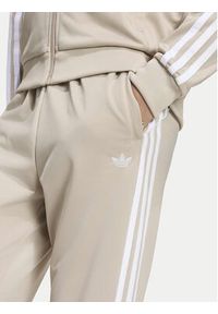 Adidas - adidas Spodnie dresowe Sst Track IA2239 Beżowy jasny Regular Fit. Kolor: beżowy. Materiał: syntetyk #8