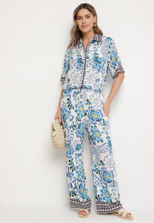 Born2be - Niebieskie Wiskozowe Spodnie o Prostym Kroju ze Ściągaczem w Talii Lielle. Okazja: na co dzień. Kolor: niebieski. Materiał: wiskoza. Wzór: kwiaty. Styl: casual, elegancki