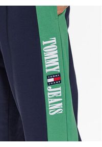 Tommy Jeans Spodnie dresowe Archive DM0DM16341 Granatowy Relaxed Fit. Kolor: niebieski. Materiał: dresówka, bawełna