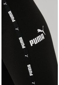 Puma legginsy Power Tape damskie kolor czarny z aplikacją. Kolor: czarny. Materiał: dzianina, skóra, bawełna. Wzór: aplikacja