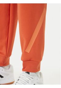Adidas - adidas Spodnie dresowe Z.N.E. KE4686 Pomarańczowy Regular Fit. Kolor: pomarańczowy. Materiał: bawełna #5
