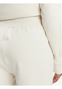 Asics Spodnie dresowe Logo 2032C844 Beżowy Regular Fit. Kolor: beżowy. Materiał: bawełna #5