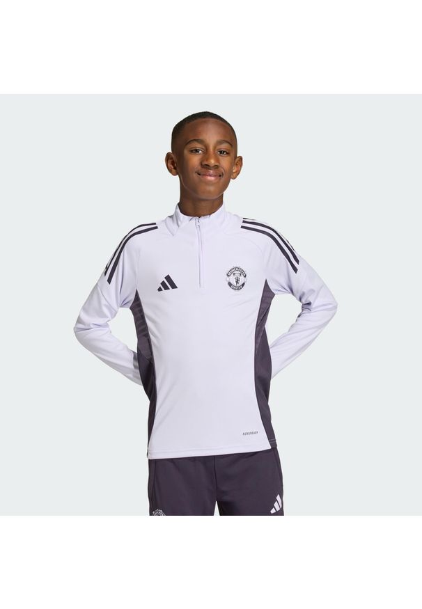 Adidas - Bluza Manchester United Tiro 25 Competition Training Kids. Kolor: fioletowy, wielokolorowy, czarny. Materiał: dresówka. Sport: piłka nożna