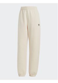 Adidas - adidas Spodnie dresowe Essentials Fleece IA6436 Écru Regular Fit. Materiał: bawełna #6