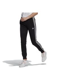 Adidas - Spodnie adidas Essentials French Terry 3-Stripes GM8733 - czarne. Kolor: czarny. Materiał: bawełna, dresówka, poliester, wiskoza. Wzór: paski. Sport: fitness #1