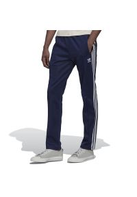Adidas - Spodnie dresowe adidas Originals Adicolor Classic Beckenbauer Primeblue Track HK7372 - granatowe. Kolor: niebieski. Materiał: dresówka. Sezon: lato