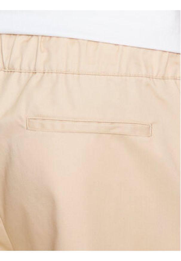 Champion Szorty materiałowe 217239 Beżowy Relaxed Fit. Kolor: beżowy. Materiał: bawełna, syntetyk