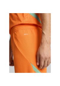 Puma - Męskie szorty Wybrzeże Kości Słoniowej 2025 PUMA Rickie Orange Jade Frost Green. Kolor: żółty, pomarańczowy, wielokolorowy, zielony