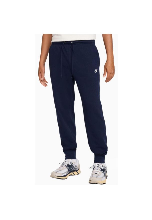 Spodnie sportowe Nike Club Jogger. Kolor: niebieski. Długość: długie