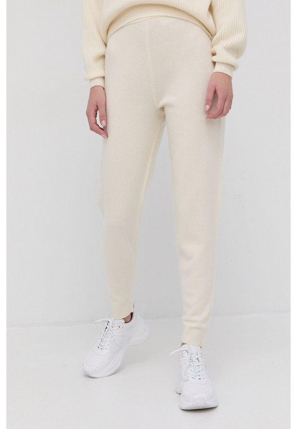 Marciano Guess Spodnie kaszmirowe damskie kolor kremowy. Stan: podwyższony. Kolor: beżowy. Materiał: kaszmir