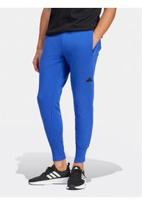 Adidas - adidas Spodnie dresowe Z.N.E. Premium IR5206 Niebieski Regular Fit. Kolor: niebieski. Materiał: bawełna, syntetyk