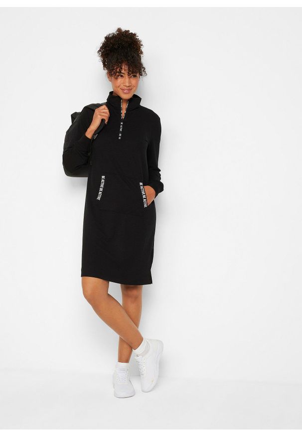 bonprix - Miękka sukienka dresowa. Typ kołnierza: kaptur. Kolor: czarny. Materiał: dresówka. Typ sukienki: sportowe. Styl: sportowy