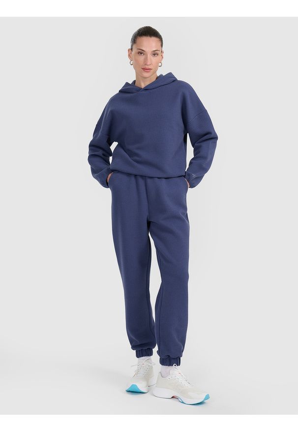 4f - 4F Spodnie dresowe z waflowej dzianiny damskie - granatowe M. Stan: podwyższony. Kolor: niebieski. Materiał: dzianina, dresówka