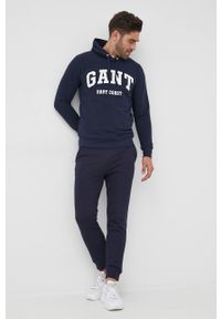 GANT - Gant Spodnie męskie kolor granatowy gładkie. Kolor: niebieski. Materiał: dzianina. Wzór: gładki