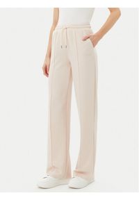 Guess Spodnie dresowe V5RB19 KCOB2 Beżowy Regular Fit. Kolor: beżowy. Materiał: syntetyk