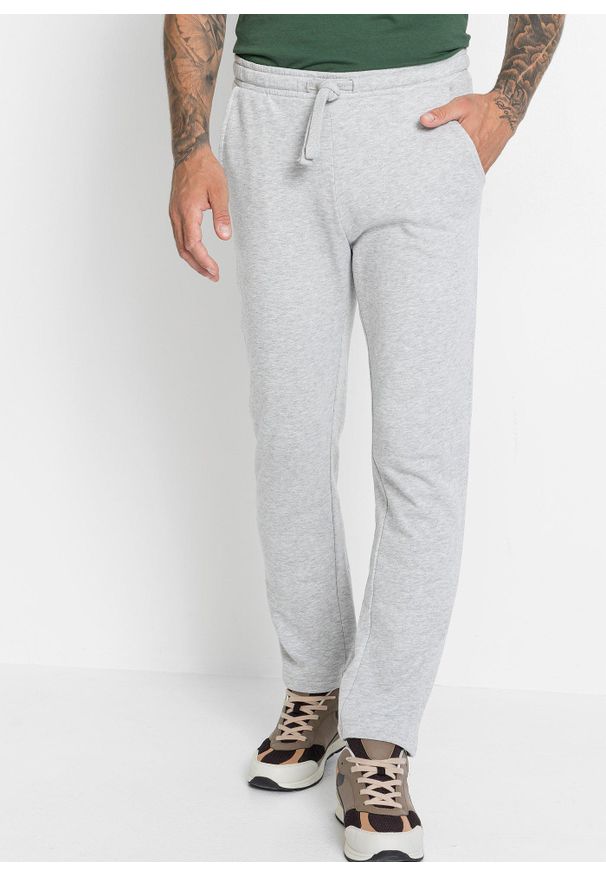 bonprix - Spodnie sportowe z miękką warstwą spodnią i równym dołem. Okazja: na co dzień. Kolor: czarny. Materiał: dzianina, dresówka. Styl: sportowy