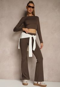 Renee - Brązowe Legginsy Dzwony High Waist Orruvana. Stan: podwyższony. Kolor: brązowy. Materiał: tkanina