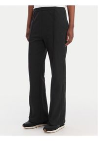 Calvin Klein Jeans Spodnie dresowe Archive Logo LV047B240G Czarny Regular Fit. Kolor: czarny. Materiał: bawełna #1