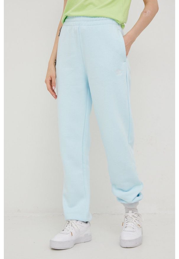 adidas Originals spodnie dresowe damskie gładkie. Kolor: niebieski. Materiał: dresówka. Wzór: gładki