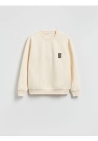 Reserved - Bluza z naszywką - złamana biel. Materiał: bawełna, dzianina. Wzór: aplikacja