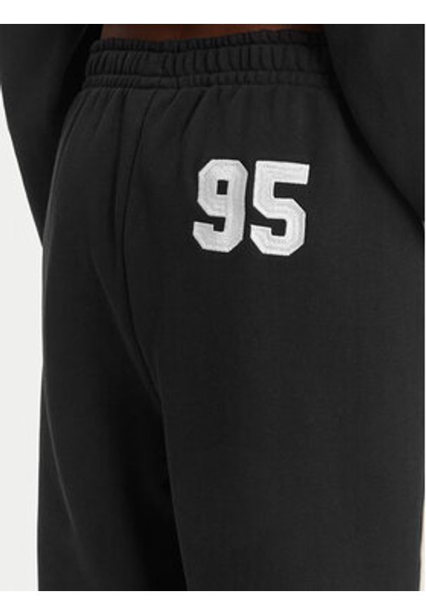 Juicy Couture Spodnie dresowe College JCSBJ126402 Czarny Relaxed Fit. Kolor: czarny. Materiał: bawełna