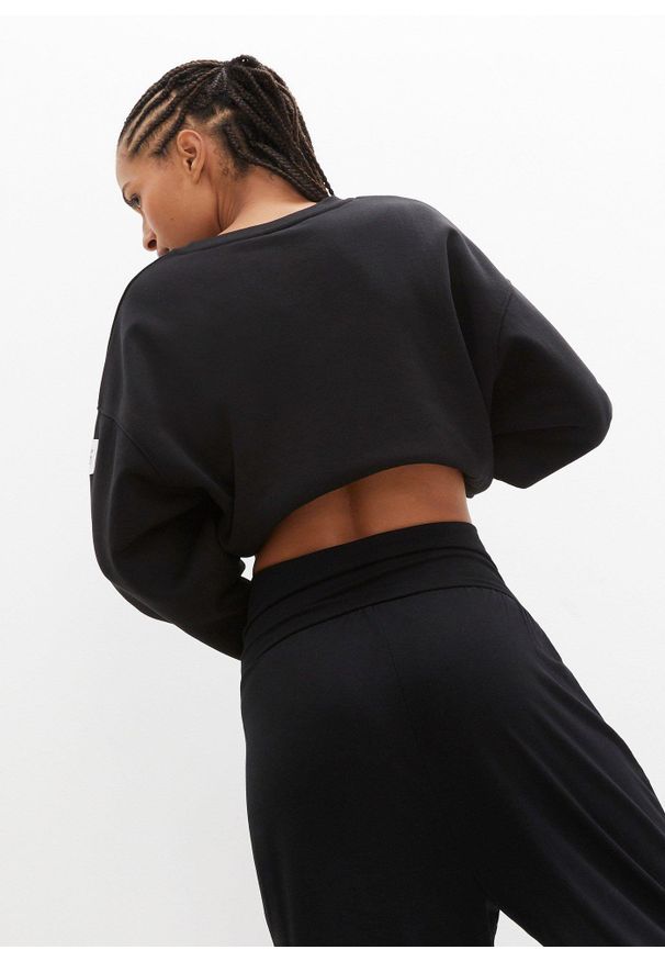 bonprix - Spodnie haremki do relaksu, dł. 3/4. Kolor: czarny. Materiał: jersey. Styl: sportowy