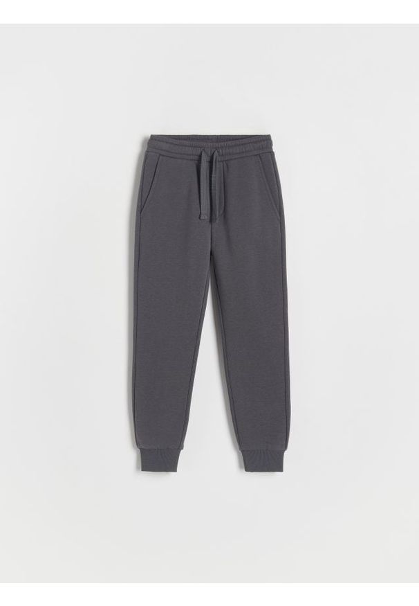 Reserved - Dresowe spodnie jogger - ciemnoszary. Kolor: szary. Materiał: dresówka. Wzór: gładki