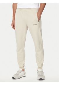 Calvin Klein Spodnie dresowe Micro Logo K10K109940 Beżowy Regular Fit. Kolor: beżowy. Materiał: bawełna
