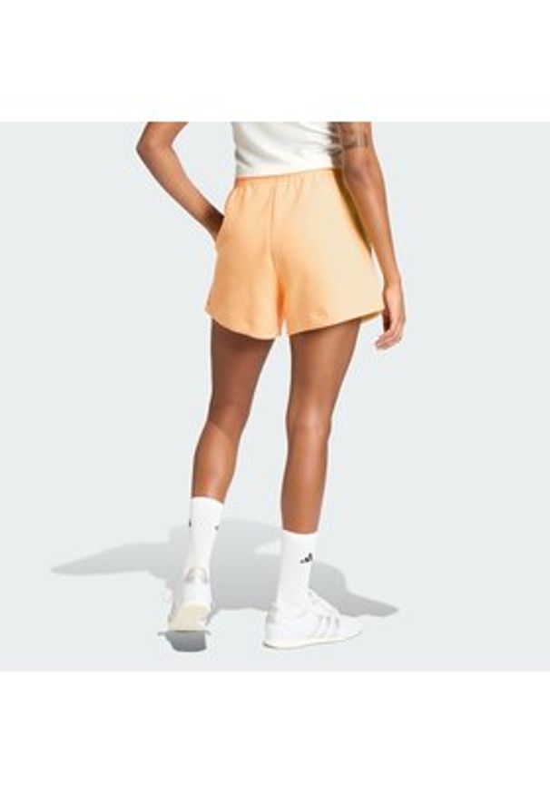Adidas - adidas Szorty sportowe Soft Lux KA6998 Pomarańczowy Loose Fit. Kolor: pomarańczowy. Materiał: syntetyk