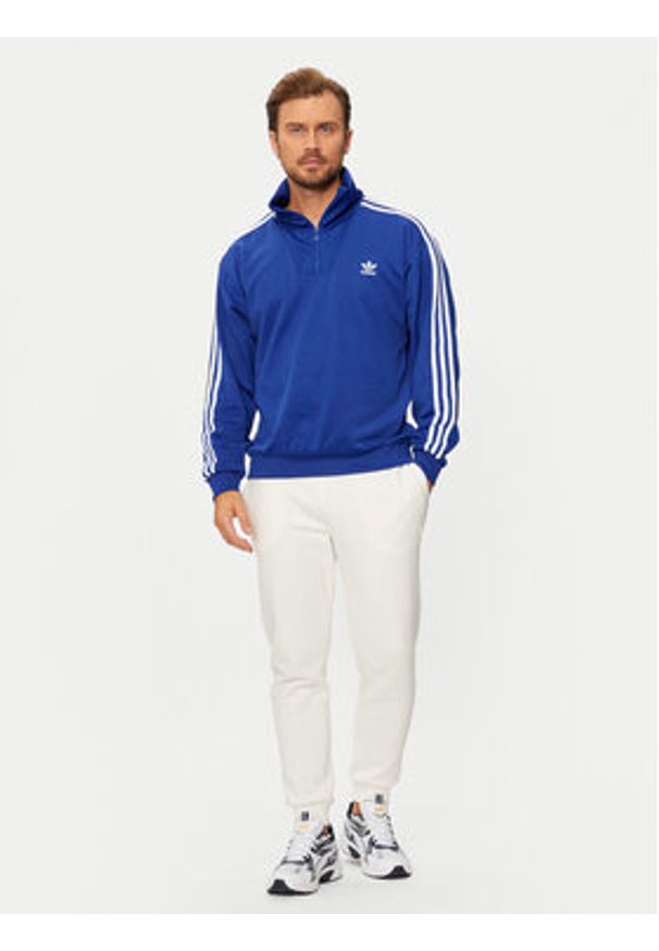 Adidas - adidas Bluza adicolor Funnel IX5216 Niebieski Regular Fit. Kolor: niebieski. Materiał: bawełna