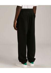PALM ANGELS - Czarne spodnie z palmą. Kolor: czarny. Materiał: dresówka, bawełna. Wzór: aplikacja #2