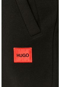 Hugo Spodnie męskie kolor czarny gładkie. Kolor: czarny. Wzór: gładki