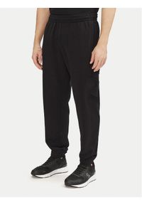 EA7 Emporio Armani Spodnie dresowe 7M000154 AF10432 UC001 Czarny Regular Fit. Kolor: czarny. Materiał: bawełna #1