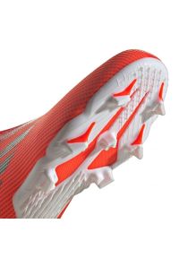 Adidas - Buty piłkarskie adidas X Speedflow.3 Fg Ll Jr FY3257 wielokolorowe pomarańcze i czerwienie. Kolor: wielokolorowy. Materiał: dzianina, syntetyk. Szerokość cholewki: normalna. Sport: piłka nożna #6