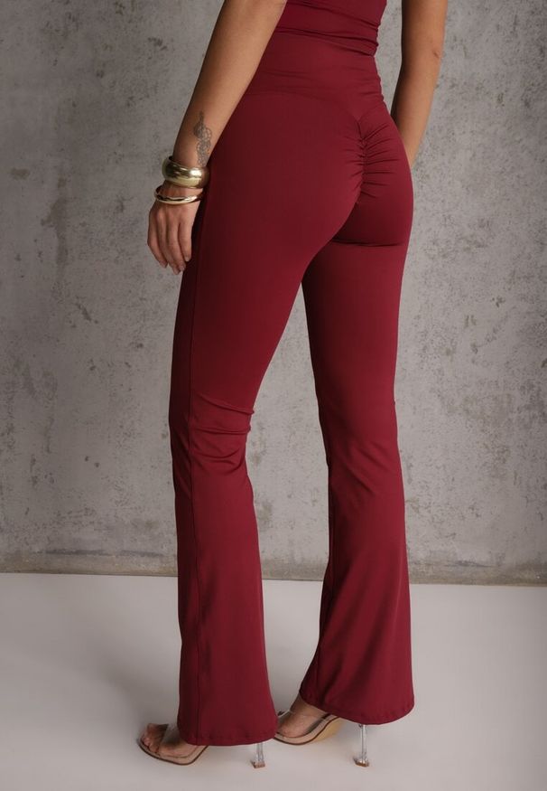 Renee - Bordowe Legginsy Dzwony High Waist Orruvana. Okazja: na co dzień. Stan: podwyższony. Kolor: czerwony. Styl: casual
