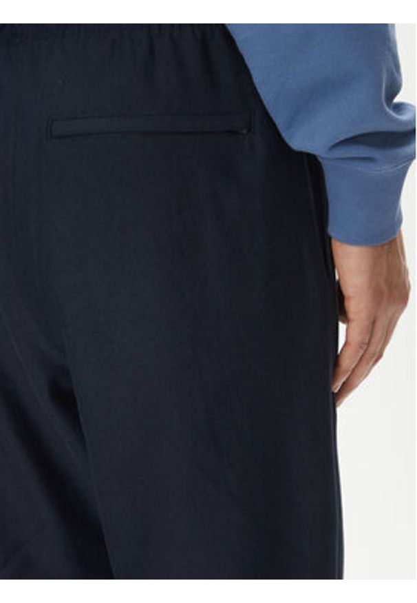 Calvin Klein Jeans Spodnie dresowe Premium LV04RC279G Granatowy Regular Fit. Kolor: niebieski. Materiał: bawełna