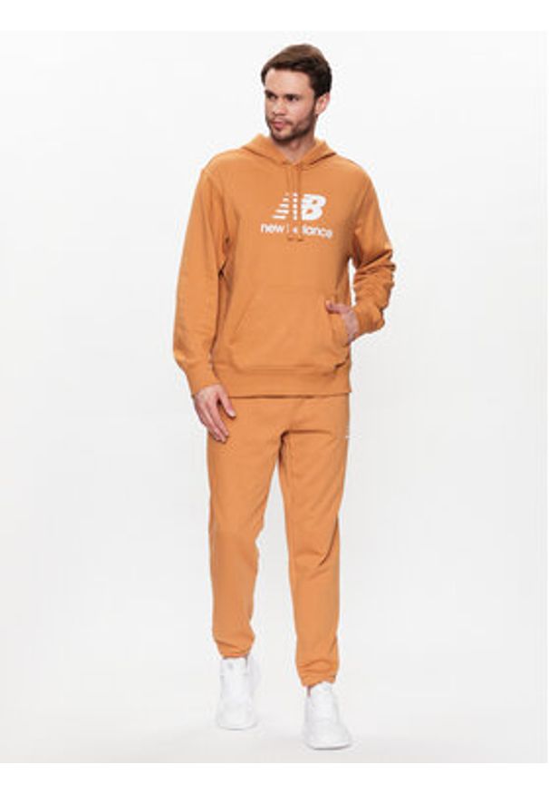 New Balance Spodnie dresowe MP31539 Żółty Regular Fit. Kolor: żółty. Materiał: bawełna