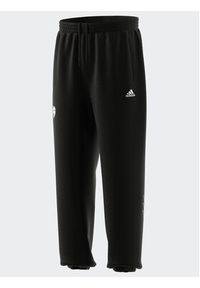 Adidas - adidas Spodnie dresowe HY1288 Czarny Loose Fit. Kolor: czarny. Materiał: dresówka, bawełna