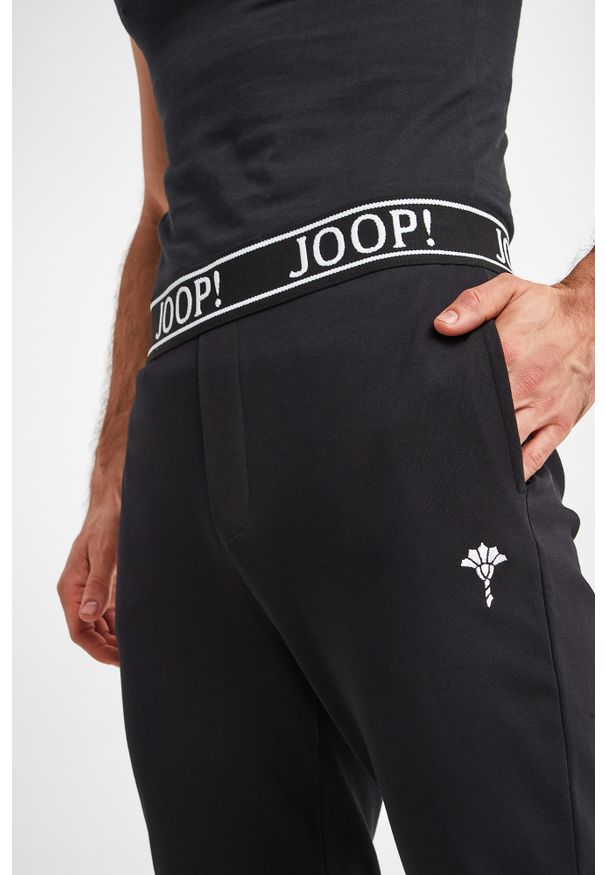 Spodnie JOOP!. Wzór: haft