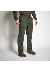 SOLOGNAC - Spodnie zimowe outdoor Solognac Warm 100 zielone. Kolor: zielony. Materiał: materiał, bawełna, poliester, poliamid. Sezon: zima. Sport: outdoor #1